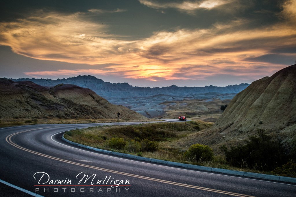 Highway-at-Sunrise-Badlands-National-Park-South-Dakota
