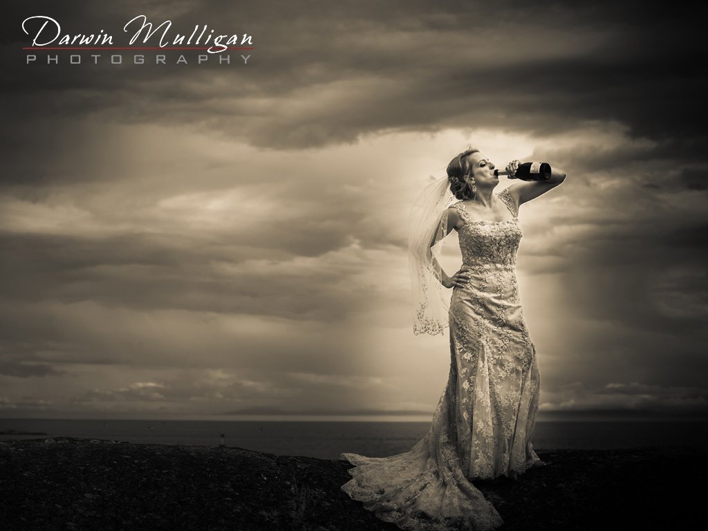 Fun-wedding-photography-with-bride-chugging-champagne